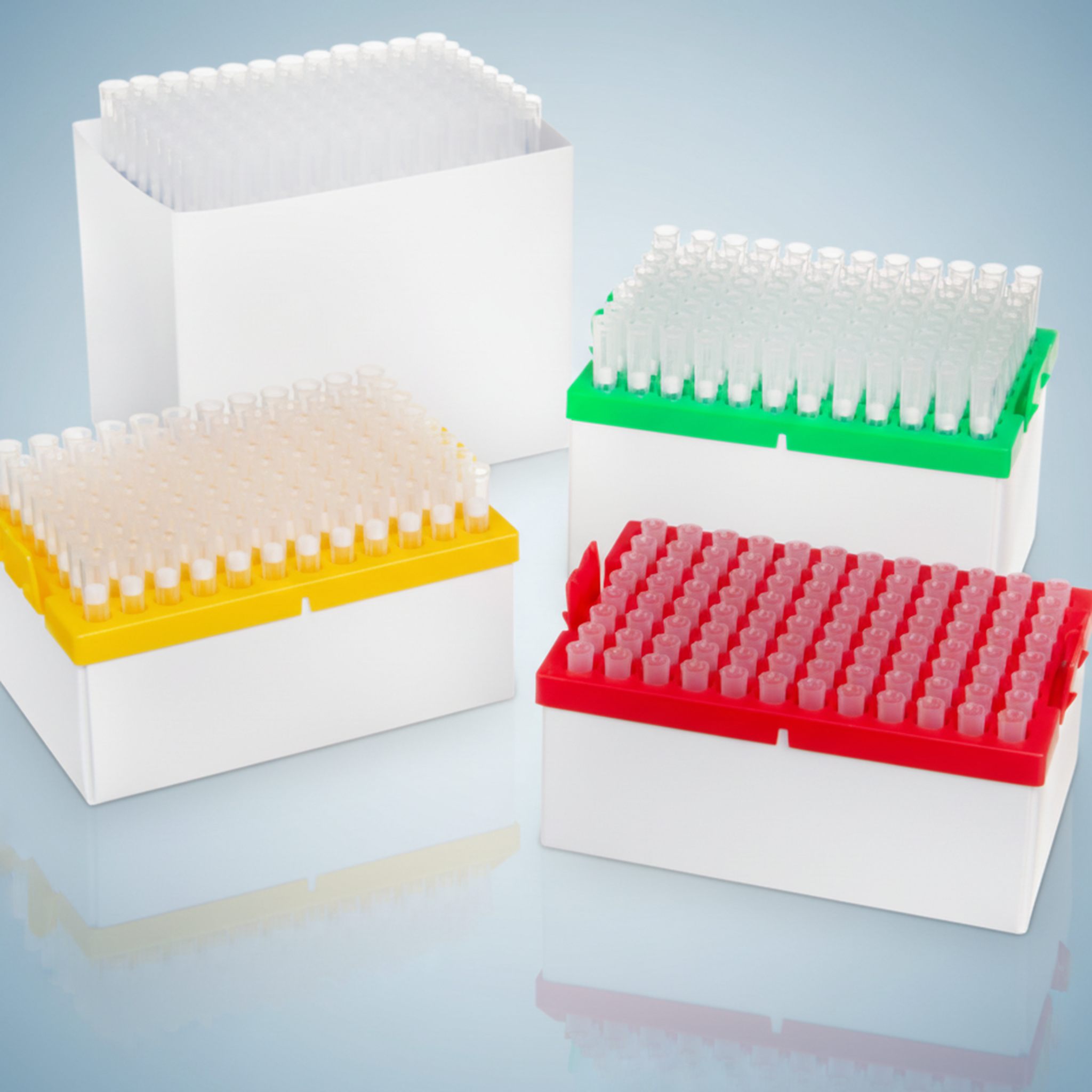 Universal filter pipette tips — color-coded racks in white cardboard packaging boxes for shipping